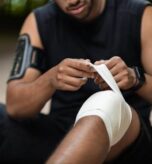 Athlete receiving knee injury care at Pain Treatment Institute.
